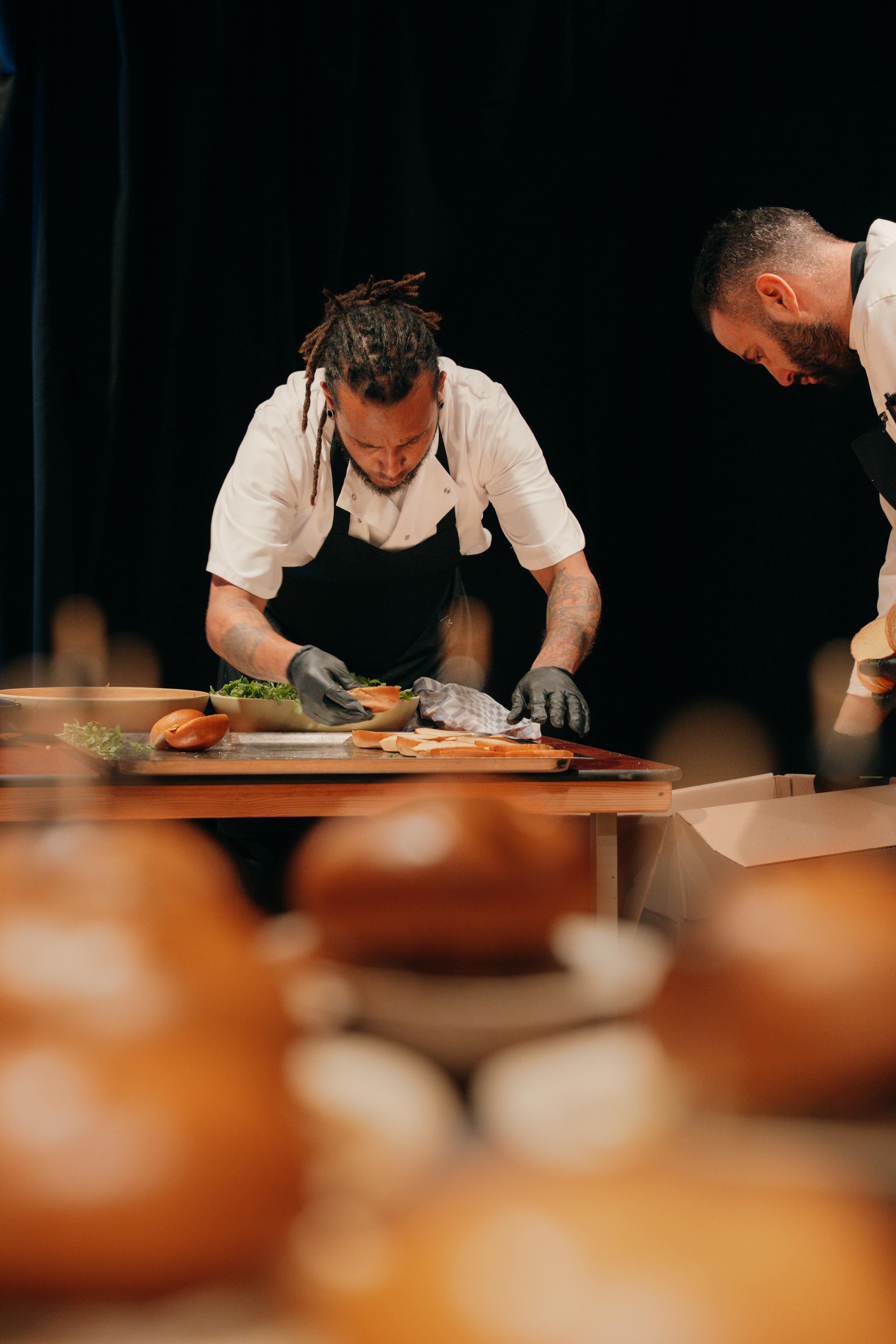 Professional chefs working with precision and focus