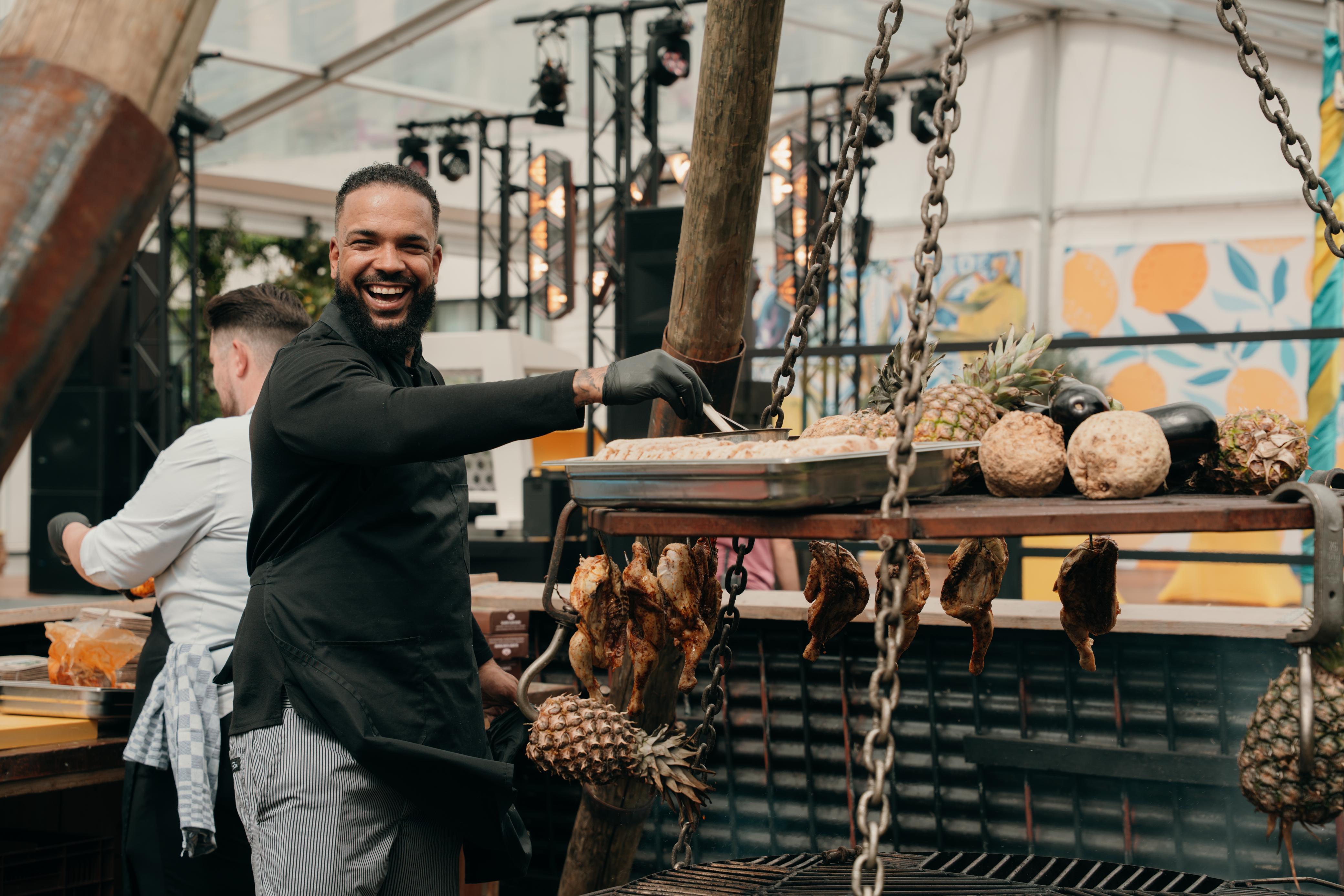 Happy chef working in vibrant restaurant environment